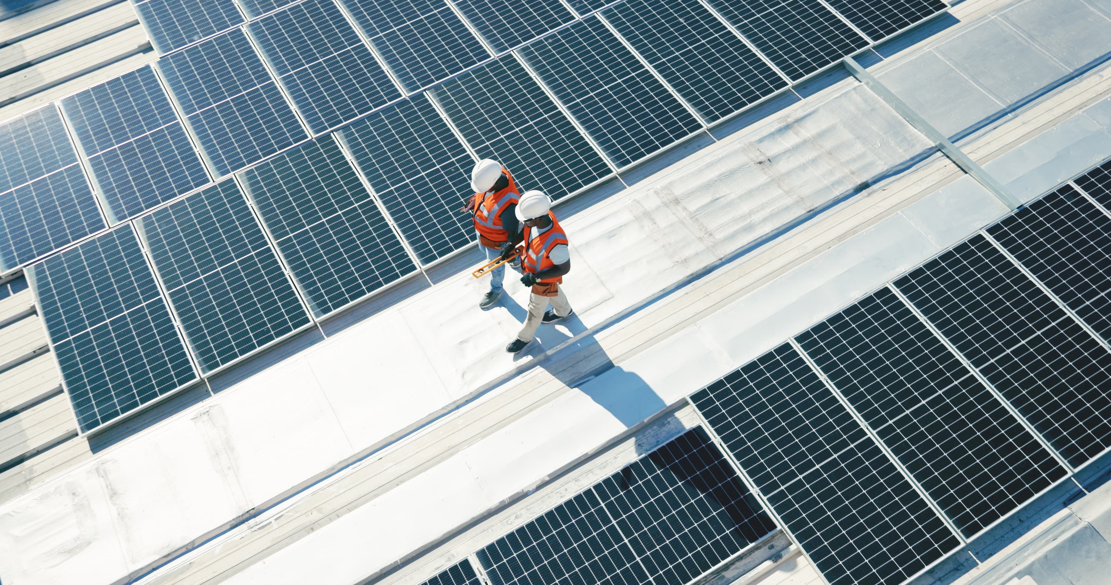 Construction workers on solar panels